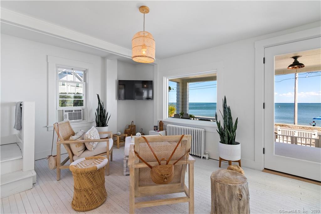 19 Soundview Drive Westport, CT 06880 - Photo 4 of 40 a living room with fireplace furniture and a flat screen tv