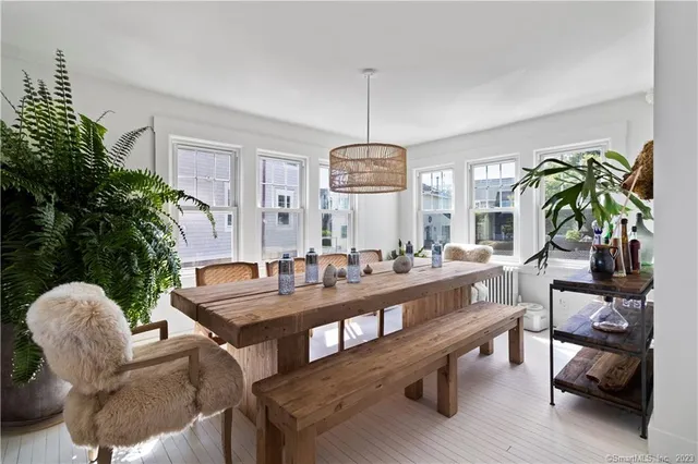 a view of a dining room with furniture and window