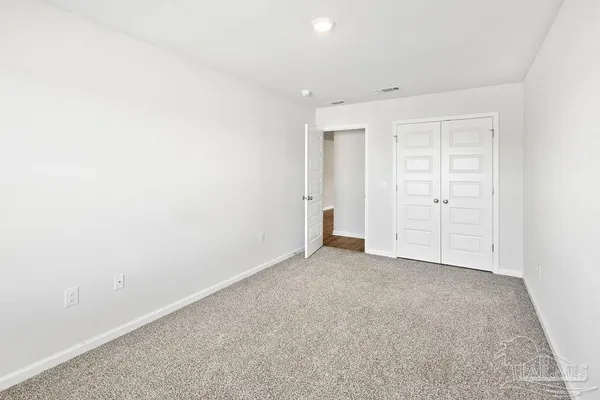 an empty room with closet