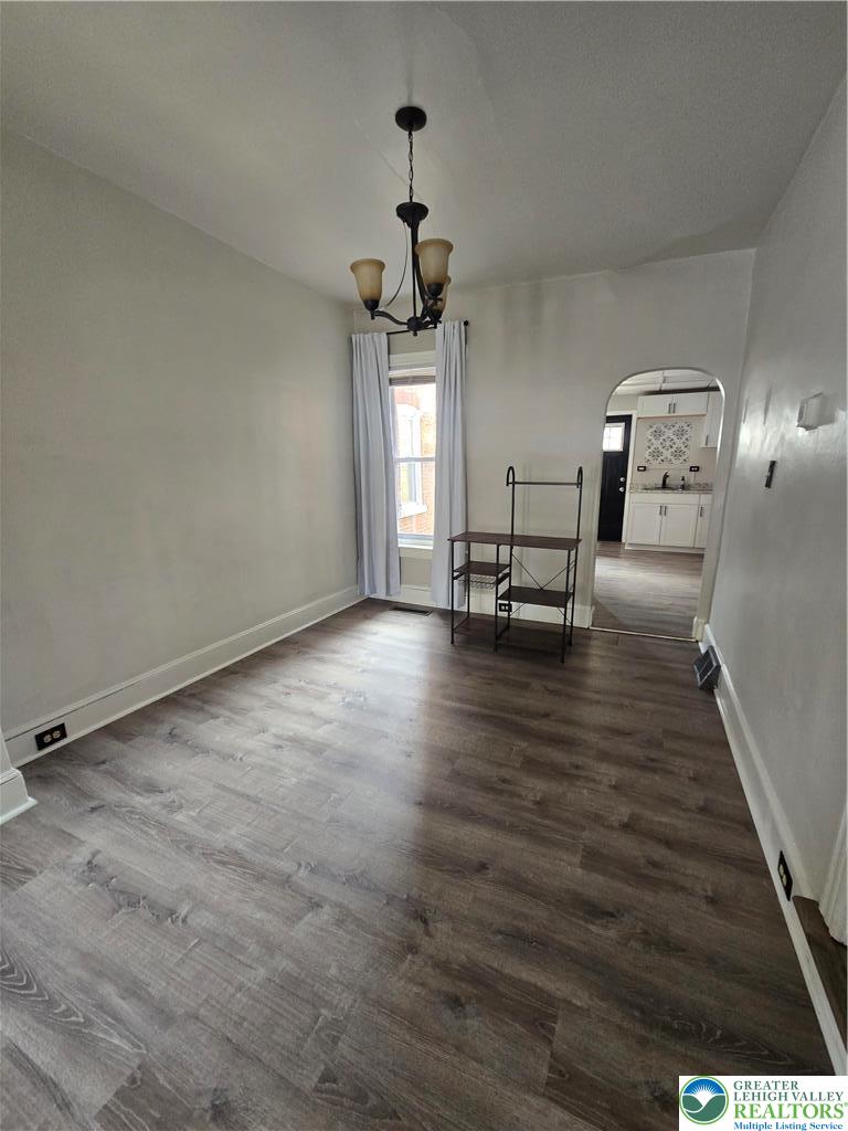 535 Pine Street Bethlehem, PA 18018 - Photo 3 of 11 wooden floor in a hall with a window