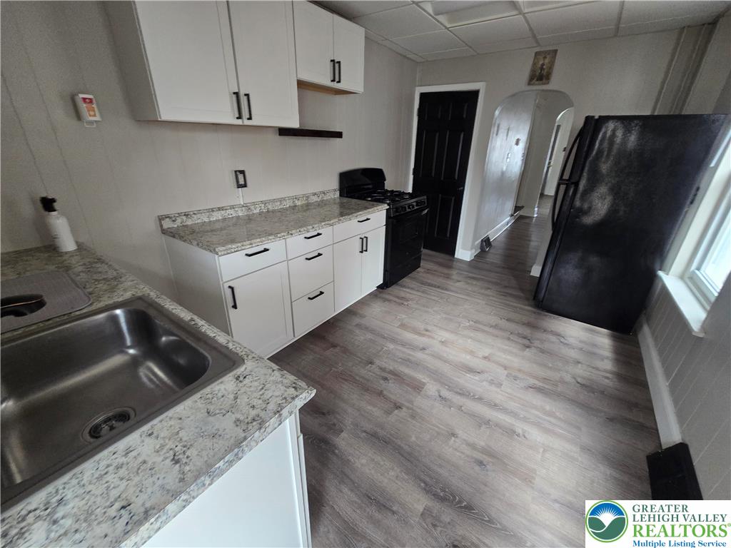 535 Pine Street Bethlehem, PA 18018 - Photo 4 of 11 a kitchen with stainless steel appliances granite countertop a sink stove and refrigerator