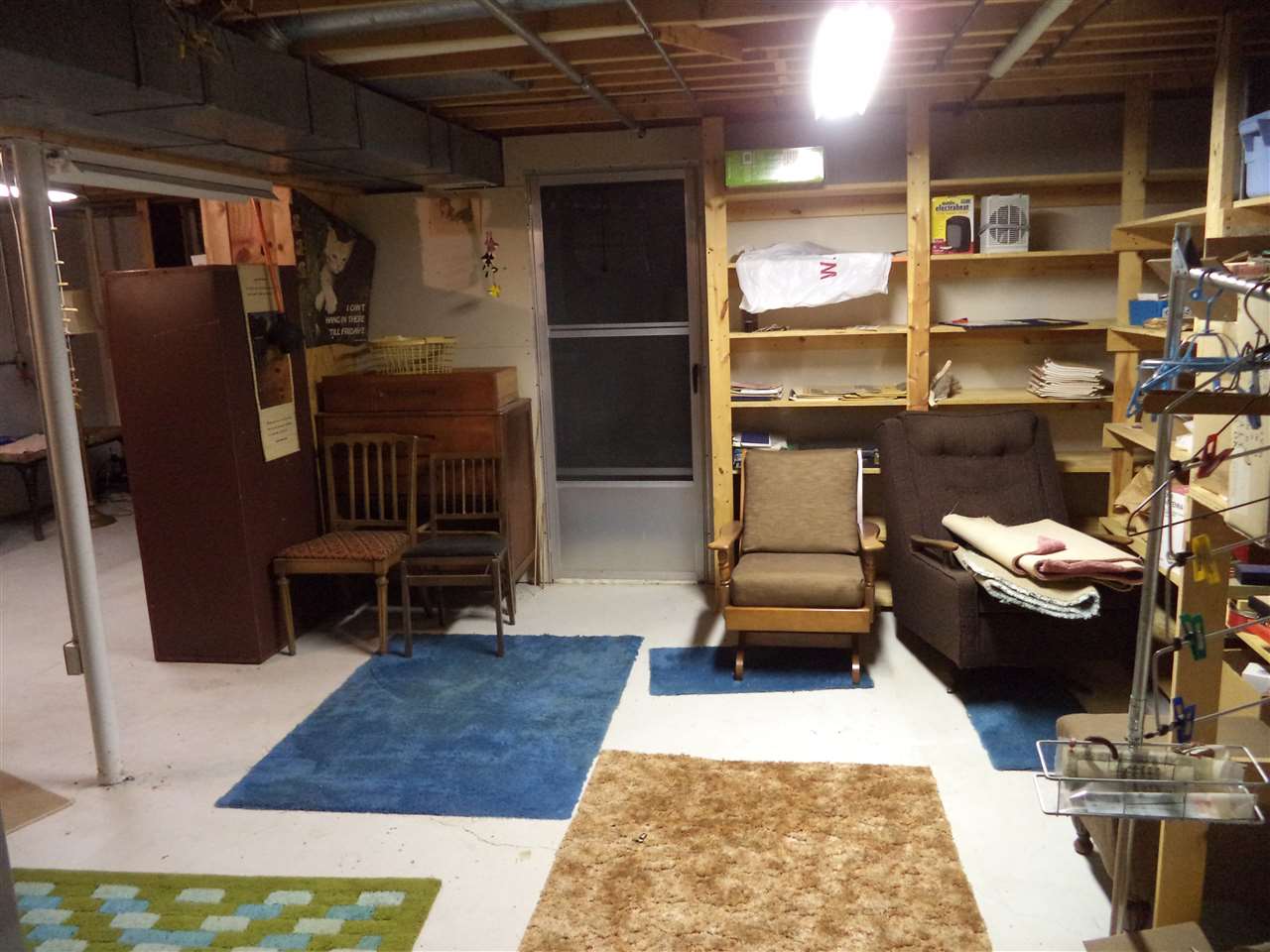 14105 Rowley Road Durand, IL 61024 - Photo 23 of 24 a living room with furniture and a rug