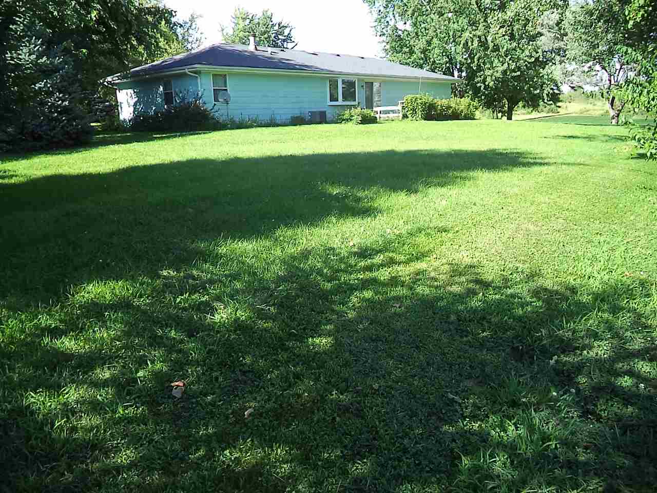 14105 Rowley Road Durand, IL 61024 - Photo 3 of 24 a view of a trees in a yard