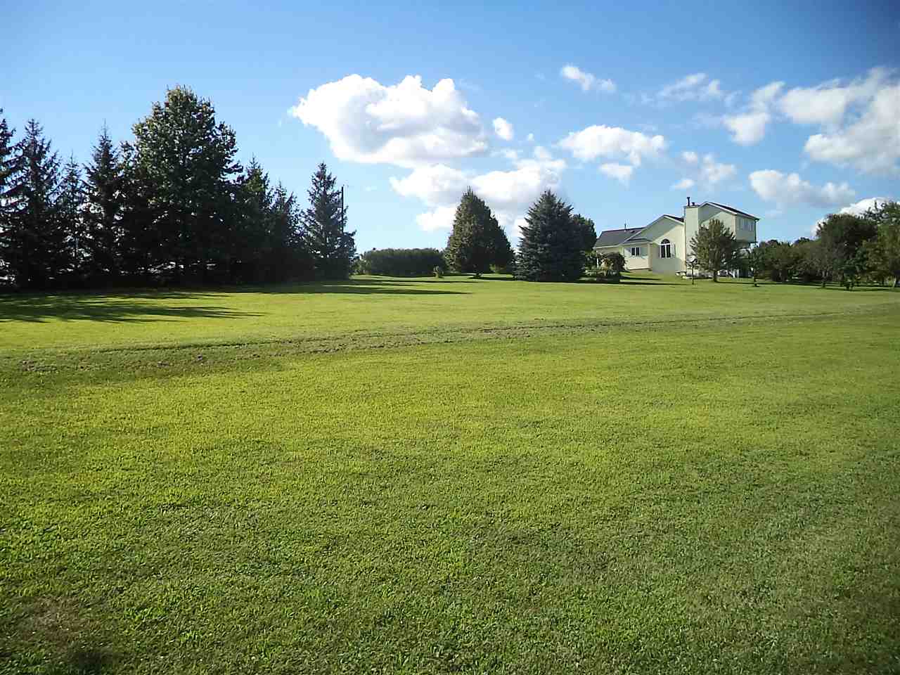 14105 Rowley Road Durand, IL 61024 - Photo 5 of 24 a view of an ocean and a yard