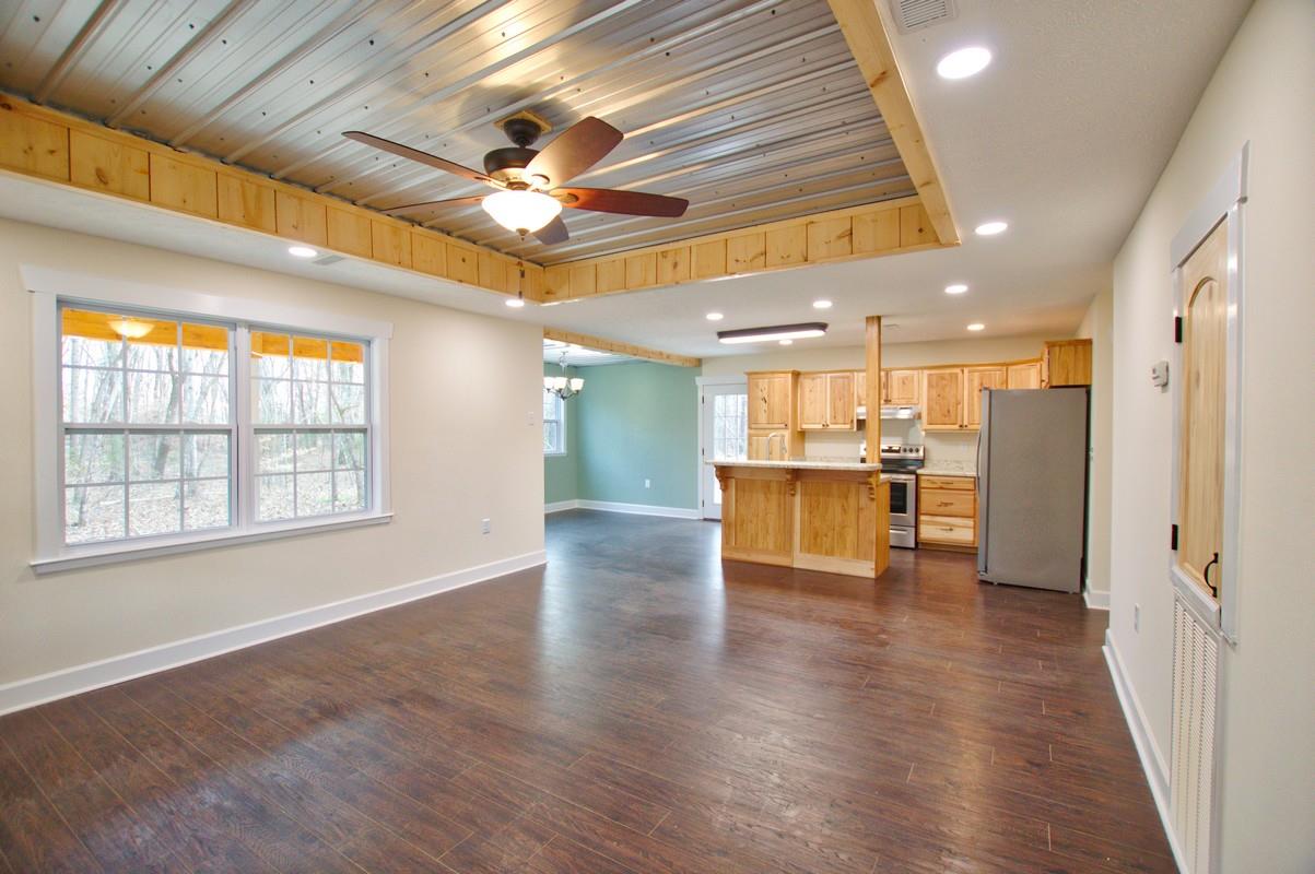 316 Talbert Road Morrison, TN 37357 - Photo 19 of 19 a view of a big room with wooden floor and a kitchen
