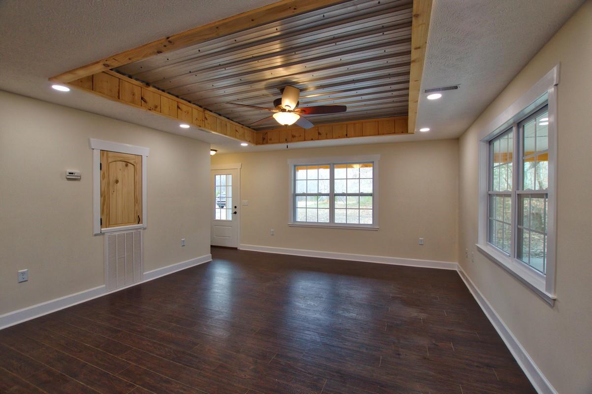316 Talbert Road Morrison, TN 37357 - Photo 5 of 19 a view of an empty room with wooden floor and a window