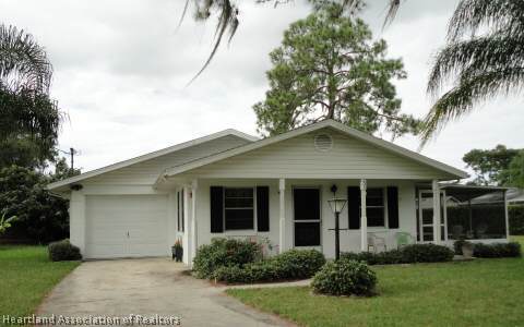203 Longview Road Sebring, FL 33870 - Photo 1 of 12 a view of a house with a yard and plants