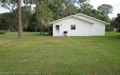 203 Longview Road Sebring, FL 33870 - Photo 12 of 12 a view of a house with backyard