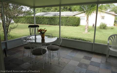 203 Longview Road Sebring, FL 33870 - Photo 5 of 12 a view of an outdoor dining space with a table chairs and balcony