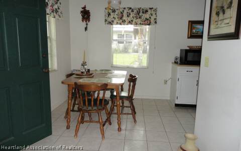 203 Longview Road Sebring, FL 33870 - Photo 6 of 12 a dining room with furniture and window