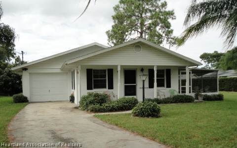 203 Longview Road Sebring, FL 33870 - Photo 10 of 12 a view of a house with a yard and plants