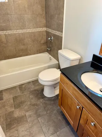 a bathroom with a toilet a sink and bathtub