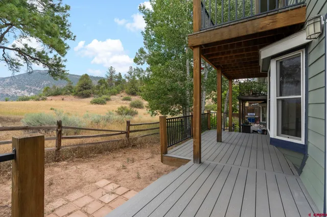 a view of a terrace with wooden floor and bench