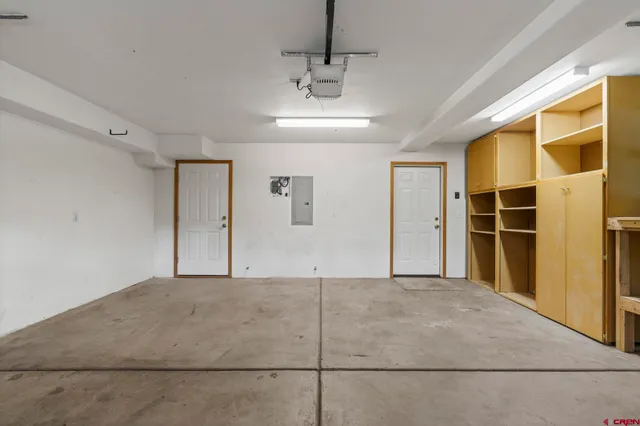 a view of an empty room with a cabinet