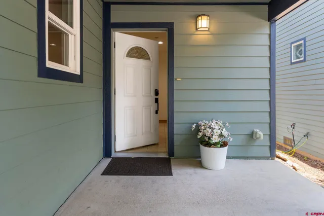 a view of a balcony with a potted plant