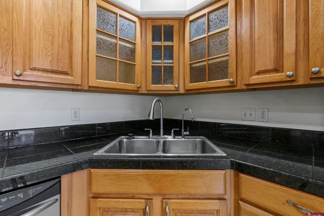 a kitchen with granite countertop cabinets and sink
