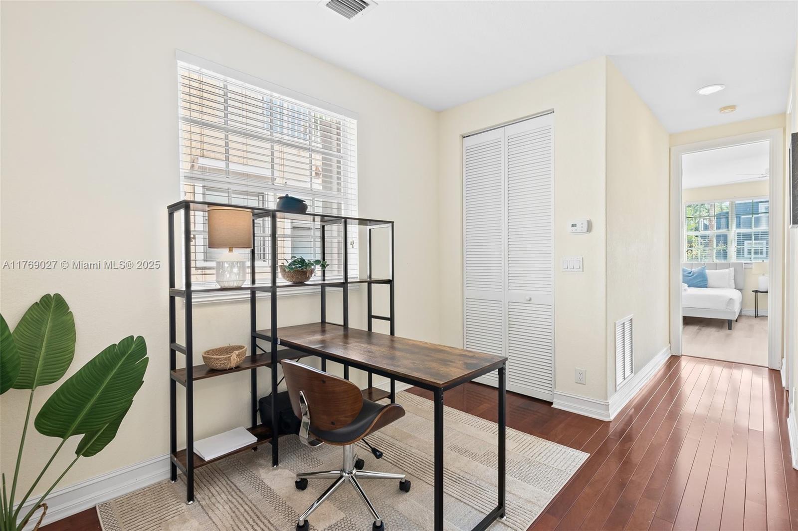 419 Southwest 5th Street, Unit 419 Fort Lauderdale, FL 33315 - Photo 12 of 44 a view of a livingroom with furniture and hardwood floor