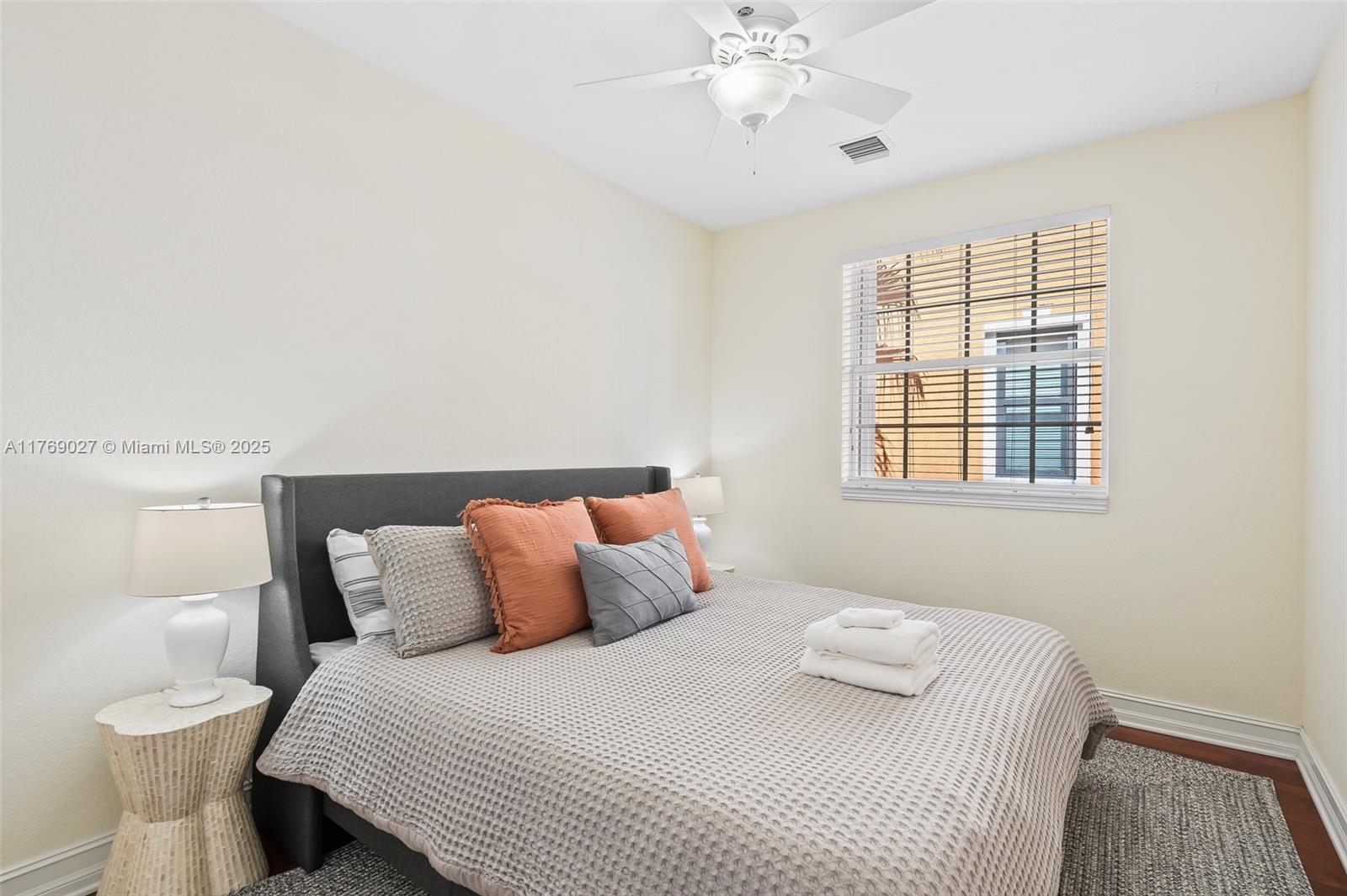 419 Southwest 5th Street, Unit 419 Fort Lauderdale, FL 33315 - Photo 17 of 44 a bedroom with a bed and window