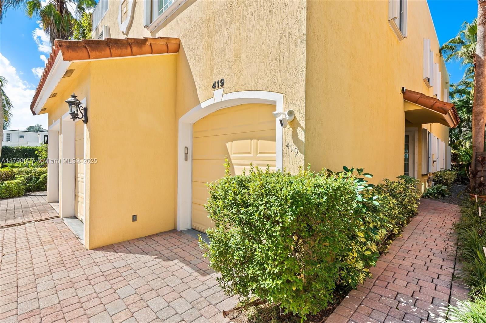 419 Southwest 5th Street, Unit 419 Fort Lauderdale, FL 33315 - Photo 33 of 44 a front view of a house with a yard