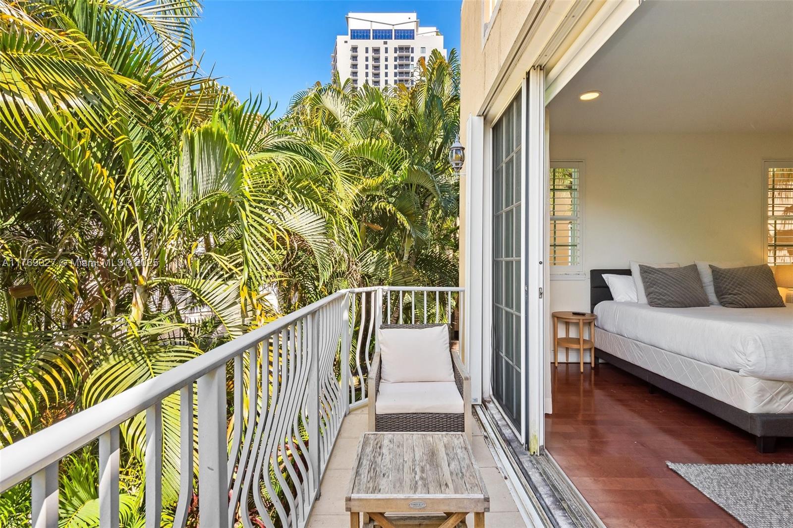 419 Southwest 5th Street, Unit 419 Fort Lauderdale, FL 33315 - Photo 36 of 44 a view of a balcony with chair and wooden floor