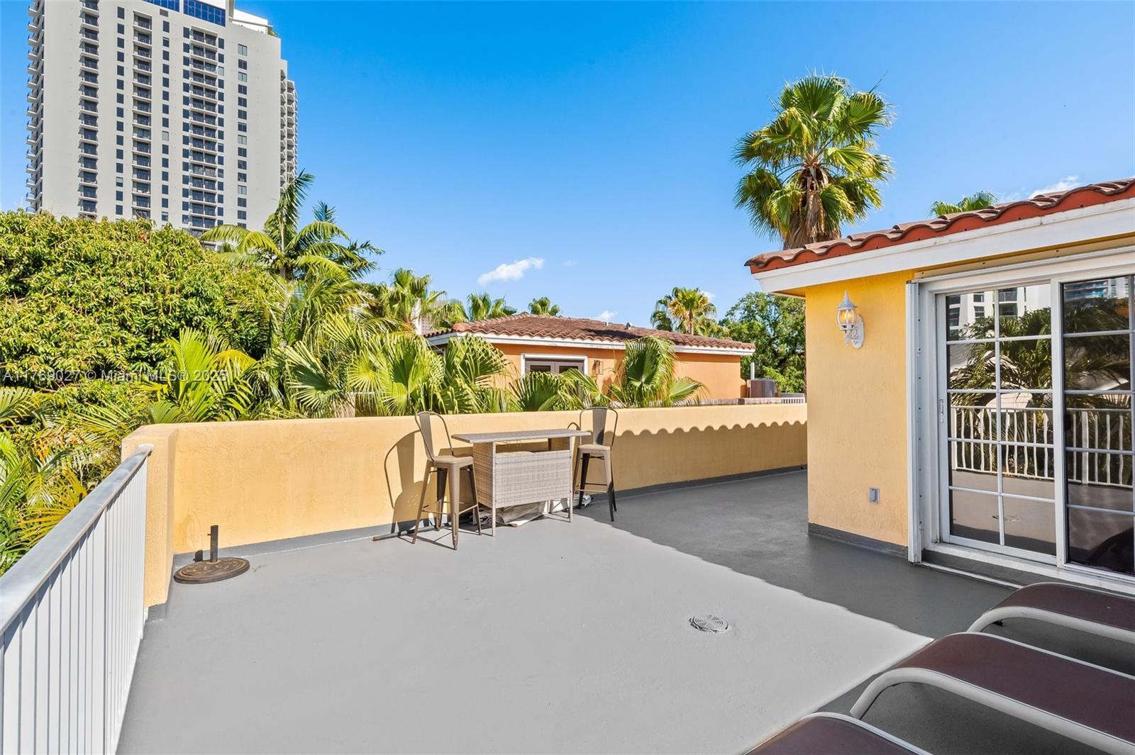 419 Southwest 5th Street, Unit 419 Fort Lauderdale, FL 33315 - Photo 40 of 44 a view of a patio with table and chairs and potted plants