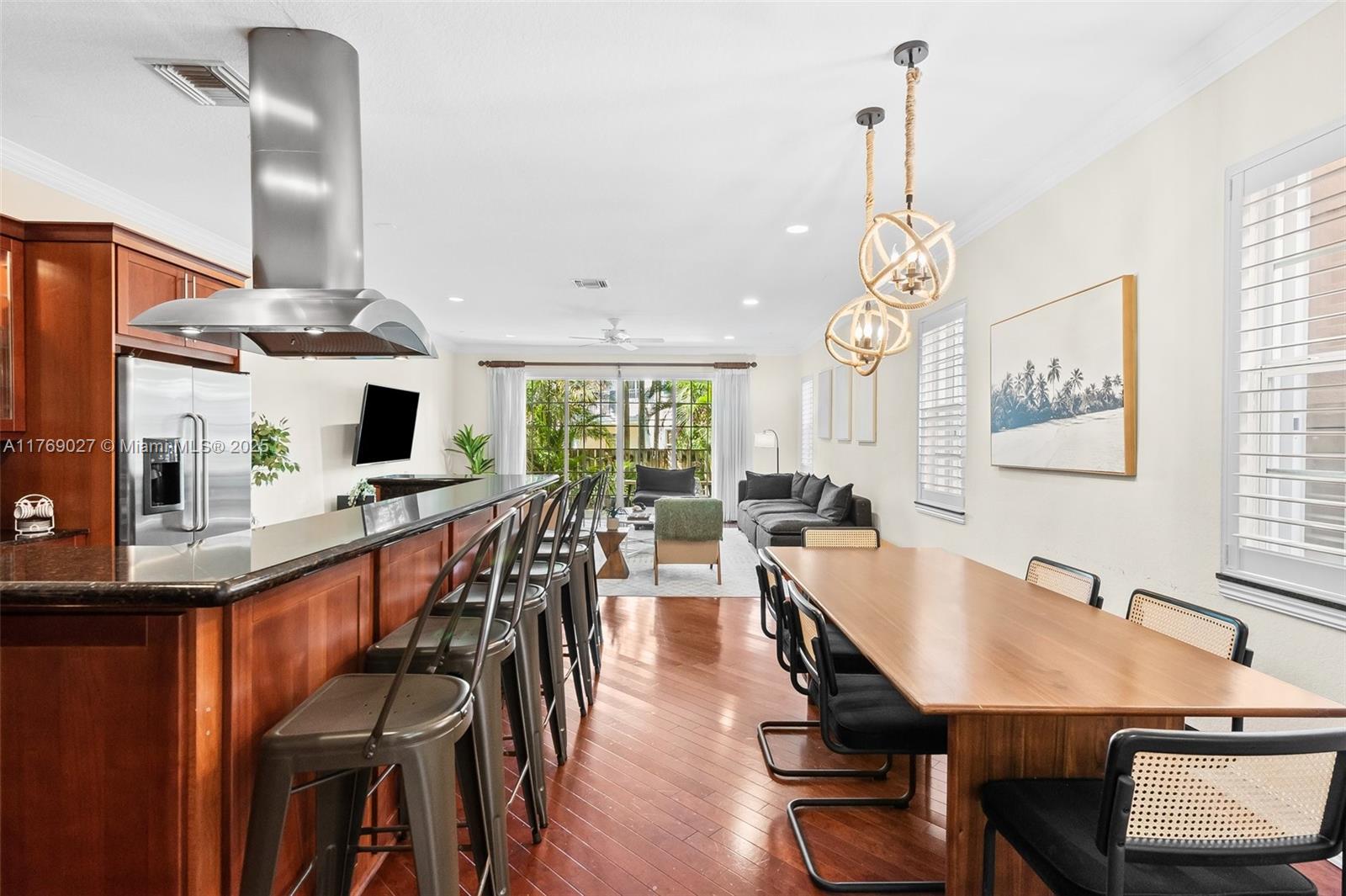 419 Southwest 5th Street, Unit 419 Fort Lauderdale, FL 33315 - Photo 9 of 44 a dining room filled chandelier and wooden floor