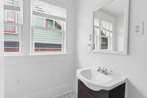 a bathroom with a sink and a mirror