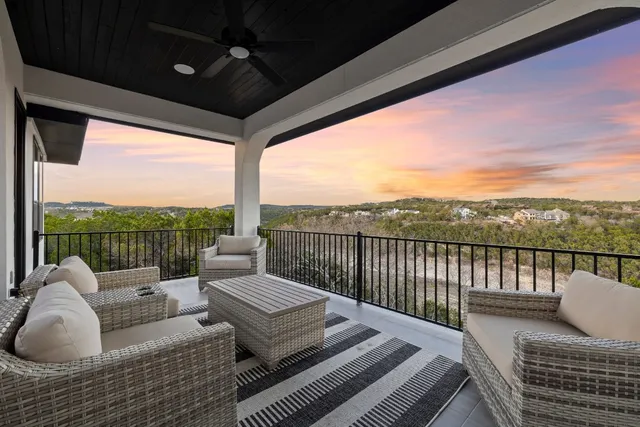 a balcony with furniture and outdoor view