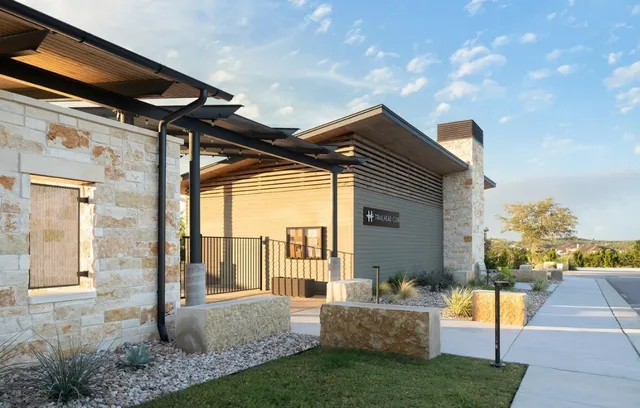 a view of house with backyard