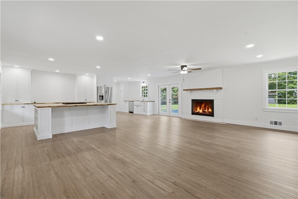 125 Childers Road Canton, GA 30115 - Photo 10 of 48 a view of kitchen with furniture and wooden floor