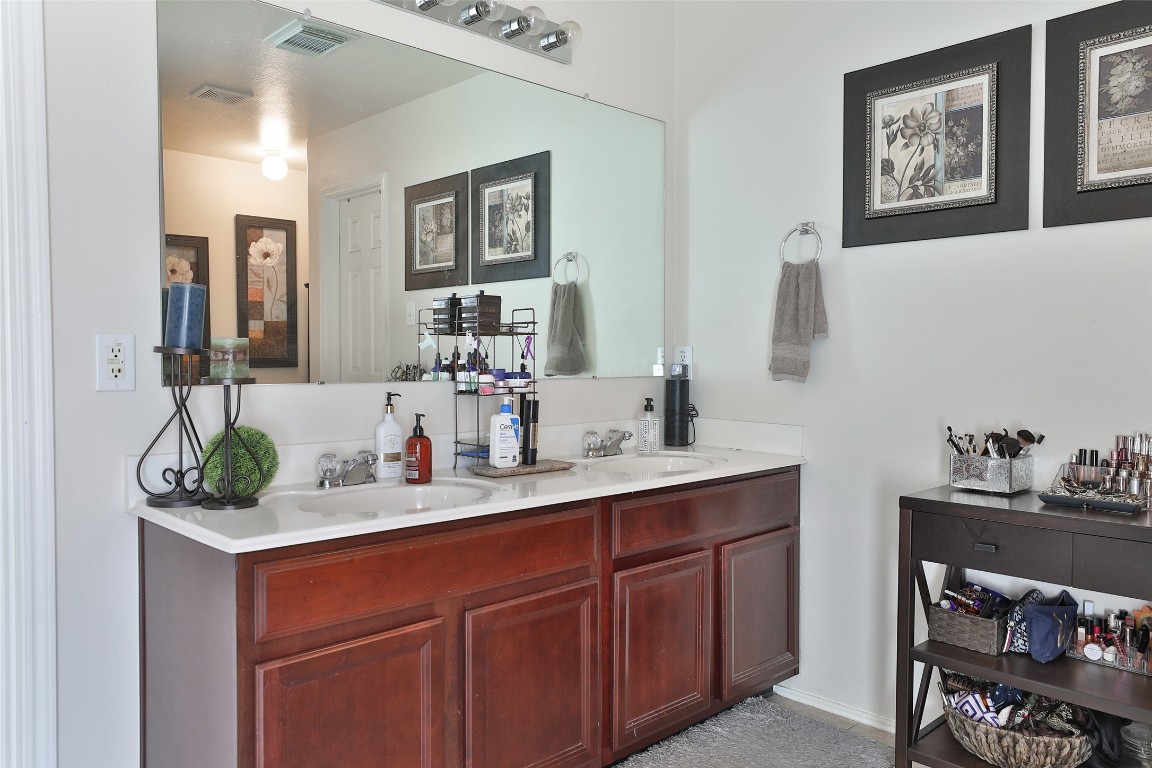 21711 Cascade Hollow Lane Spring, TX 77379 - Photo 16 of 24 a bathroom with a sink and a mirror