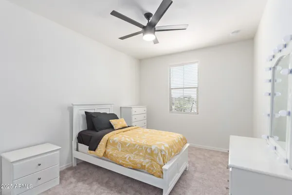 a bedroom with a bed and a cabinets