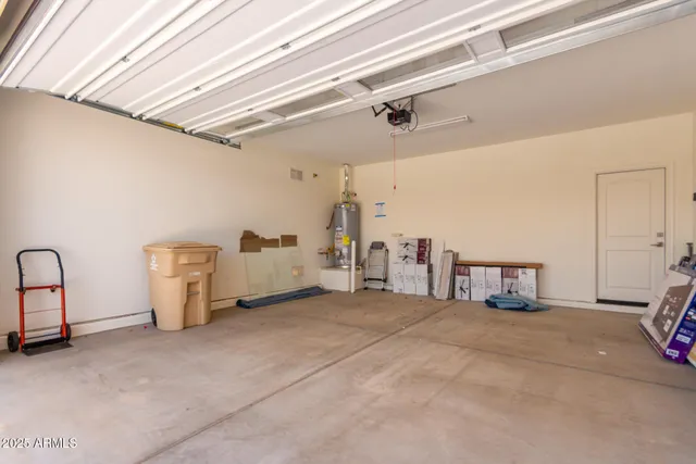 a view of a room with refrigerator and washer