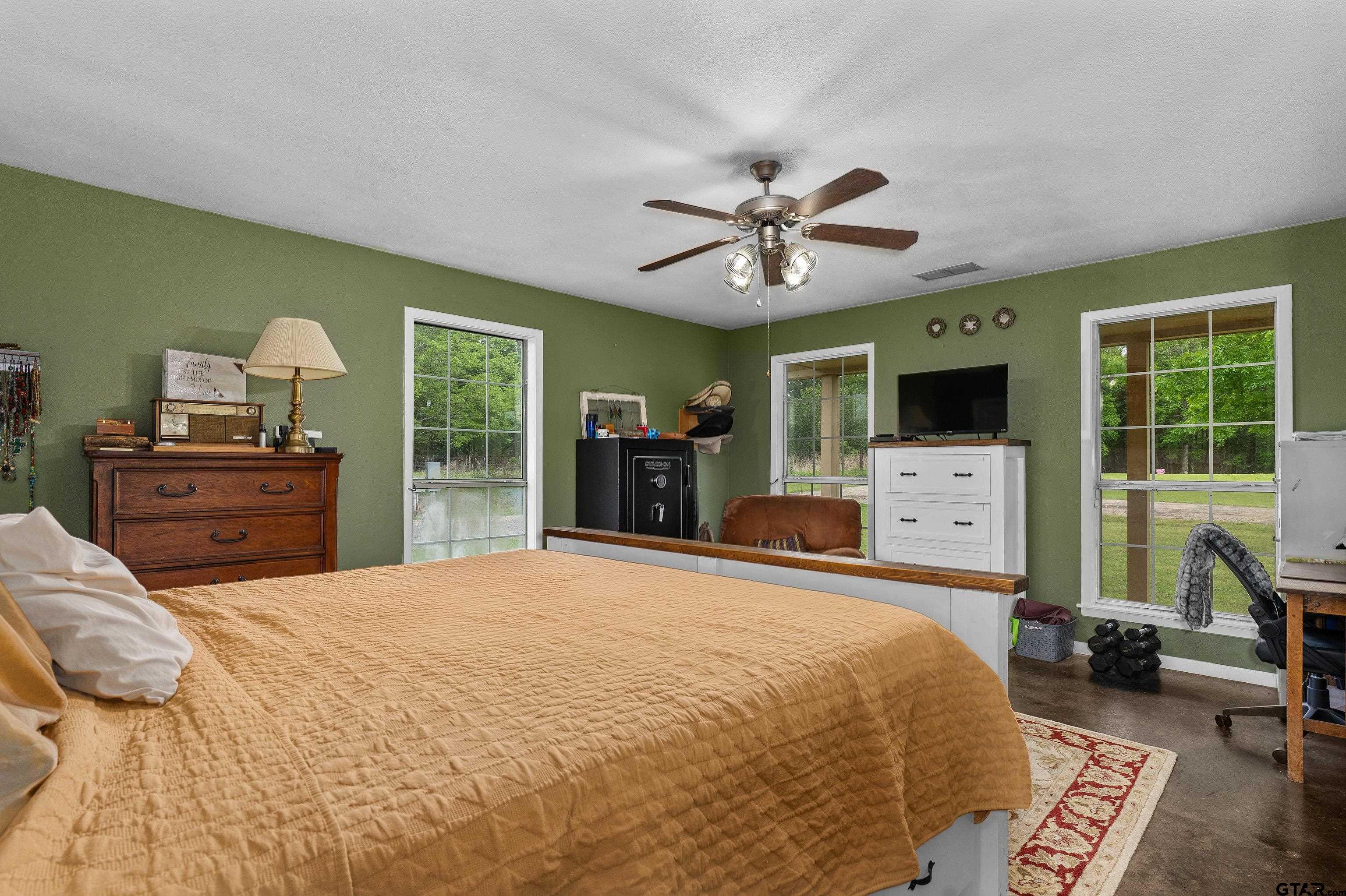 8550 New Hope Road Gilmer, TX 75645 - Photo 8 of 12 a bed room with a bed window and a television