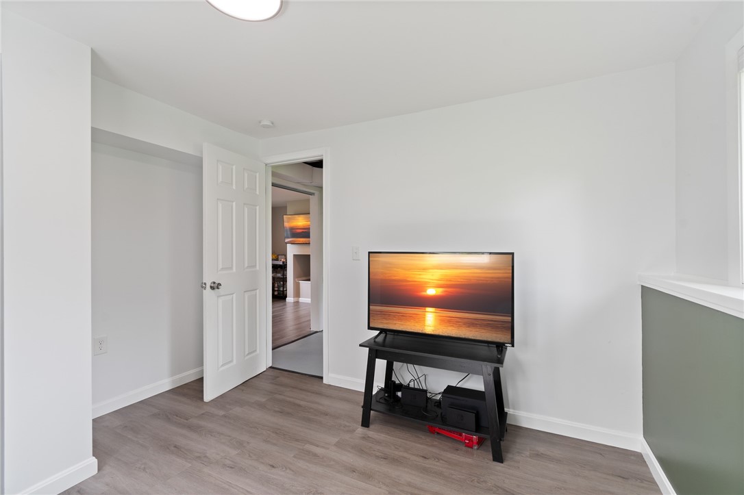 218 Kusak Road Henrietta, NY 14467 - Photo 25 of 33 Fourth bedroom with door to laundry area and famil