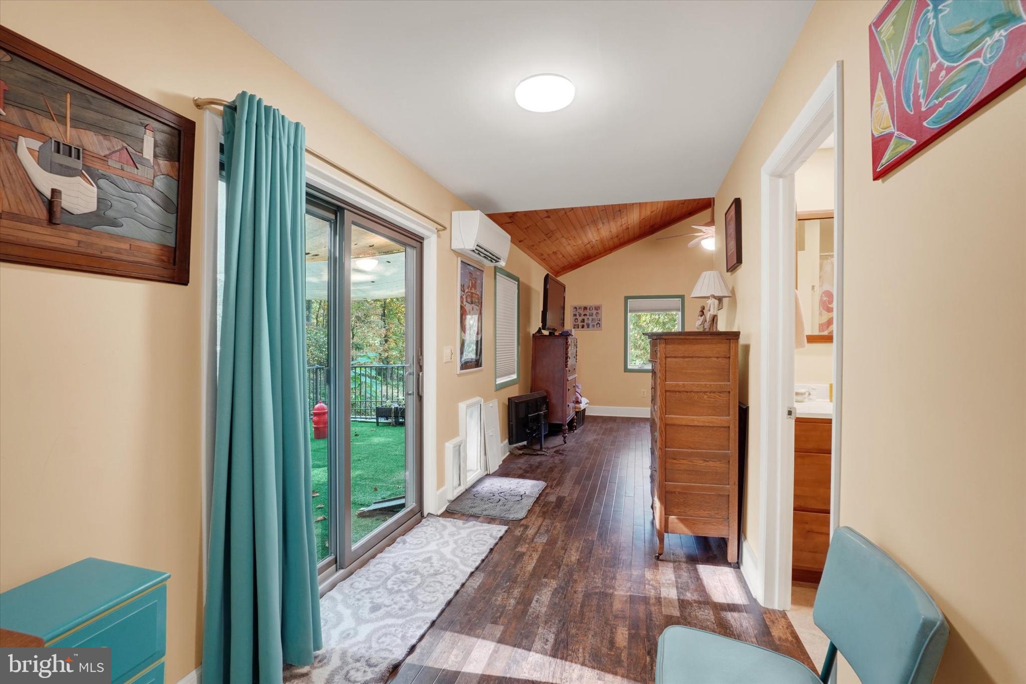 127 Halls Road Red Lion, PA 17356 - Photo 26 of 133 a hallway with wooden floor windows and a livingroom
