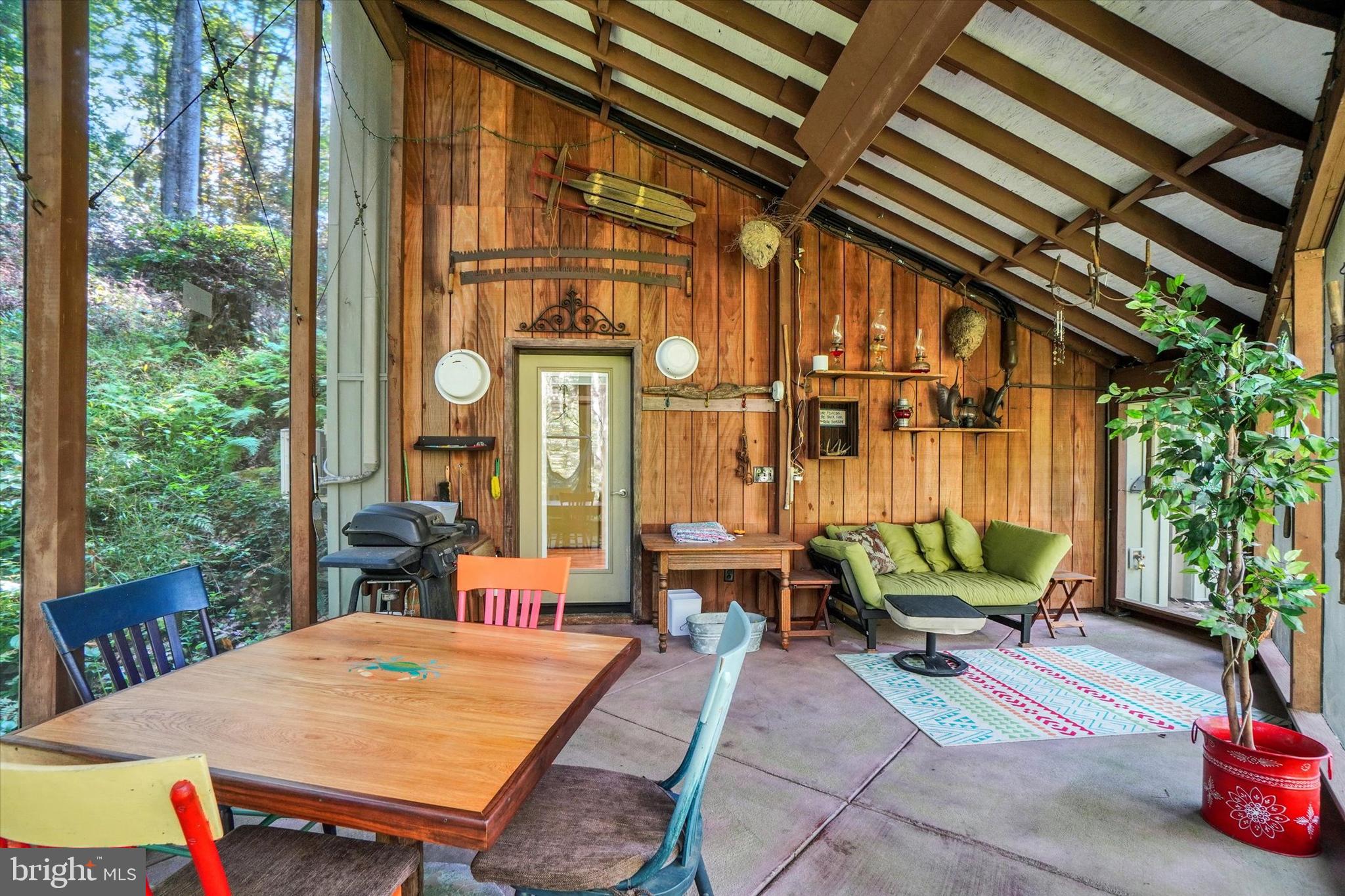 127 Halls Road Red Lion, PA 17356 - Photo 31 of 133 a view of a patio with table and chairs potted plants with wooden floor