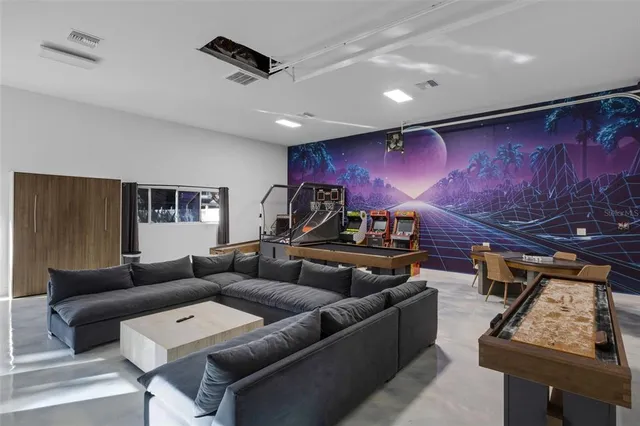 a living room with furniture and a potted plant