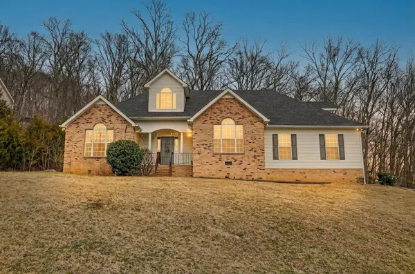 a front view of a house with a yard