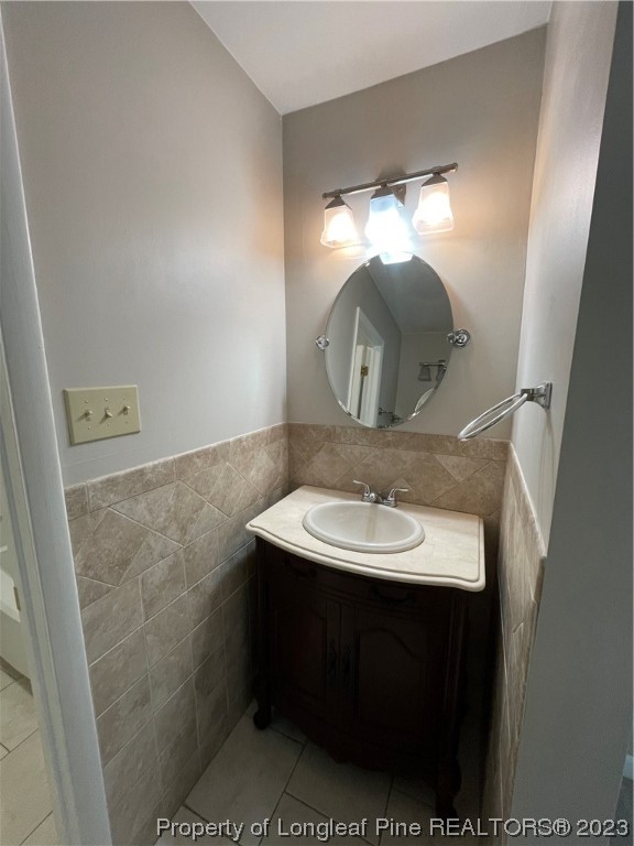 3308 Arrowhead Road Spring Lake, NC 28390 - Photo 12 of 13 a bathroom with a sink and a mirror