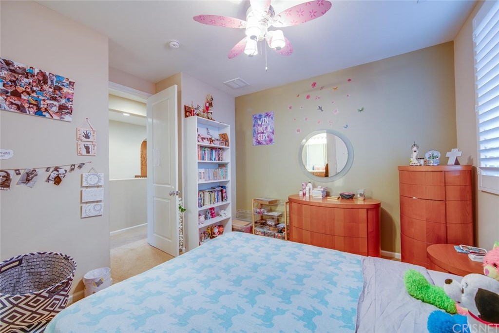 20855 Piazza Way Porter Ranch, CA 91326 - Photo 11 of 38 a bedroom with a bed and cabinets