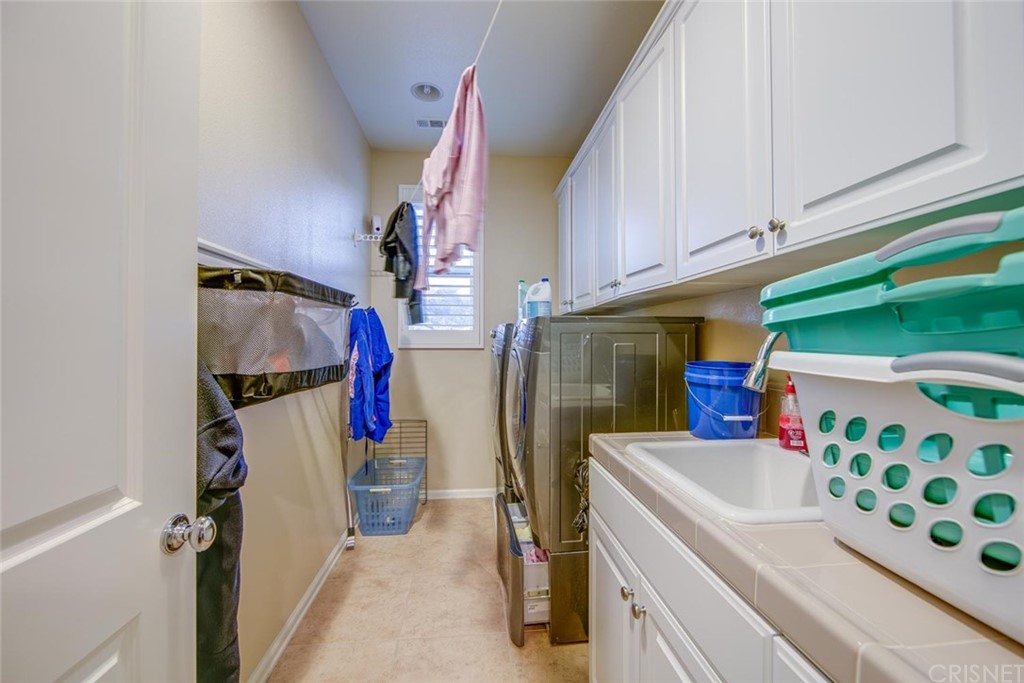 20855 Piazza Way Porter Ranch, CA 91326 - Photo 14 of 38 a view of storage and utility room