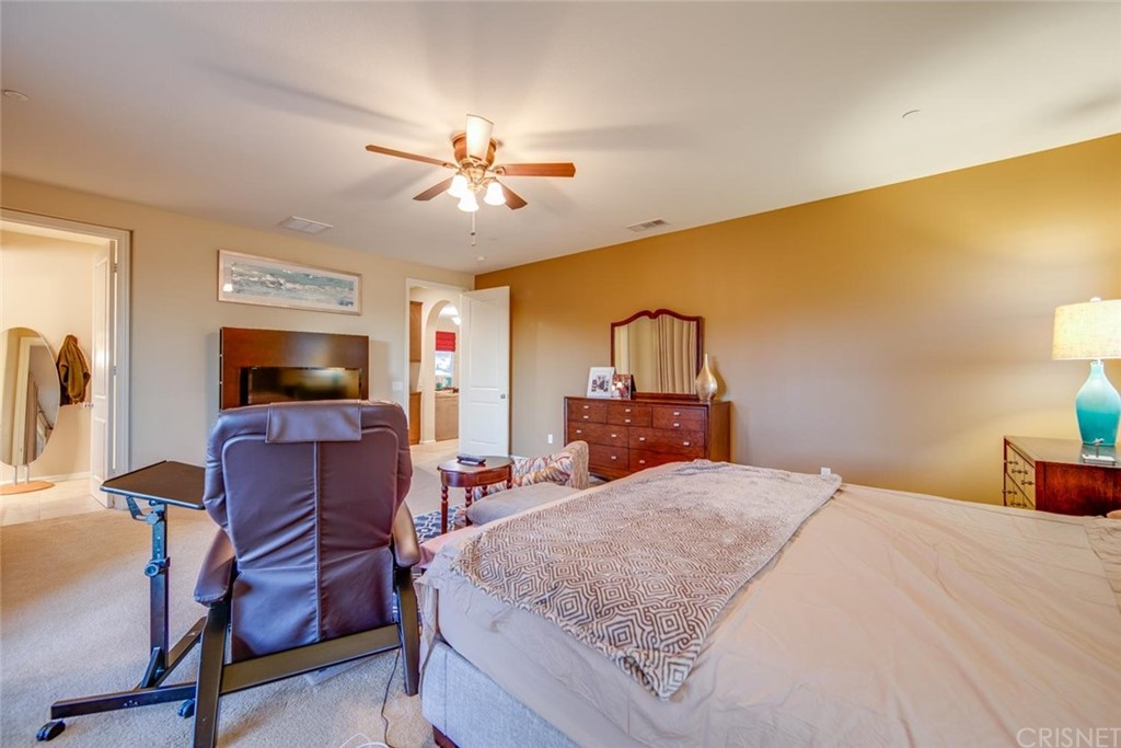 20855 Piazza Way Porter Ranch, CA 91326 - Photo 16 of 38 a bedroom with a bed and a flat screen tv