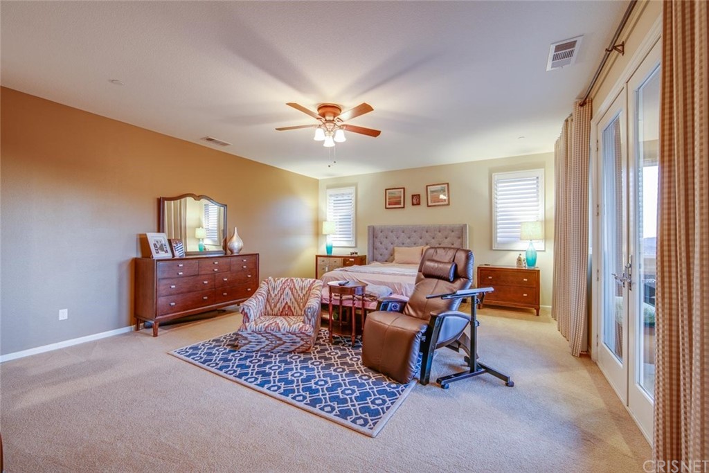 20855 Piazza Way Porter Ranch, CA 91326 - Photo 17 of 38 a living room with furniture and a window
