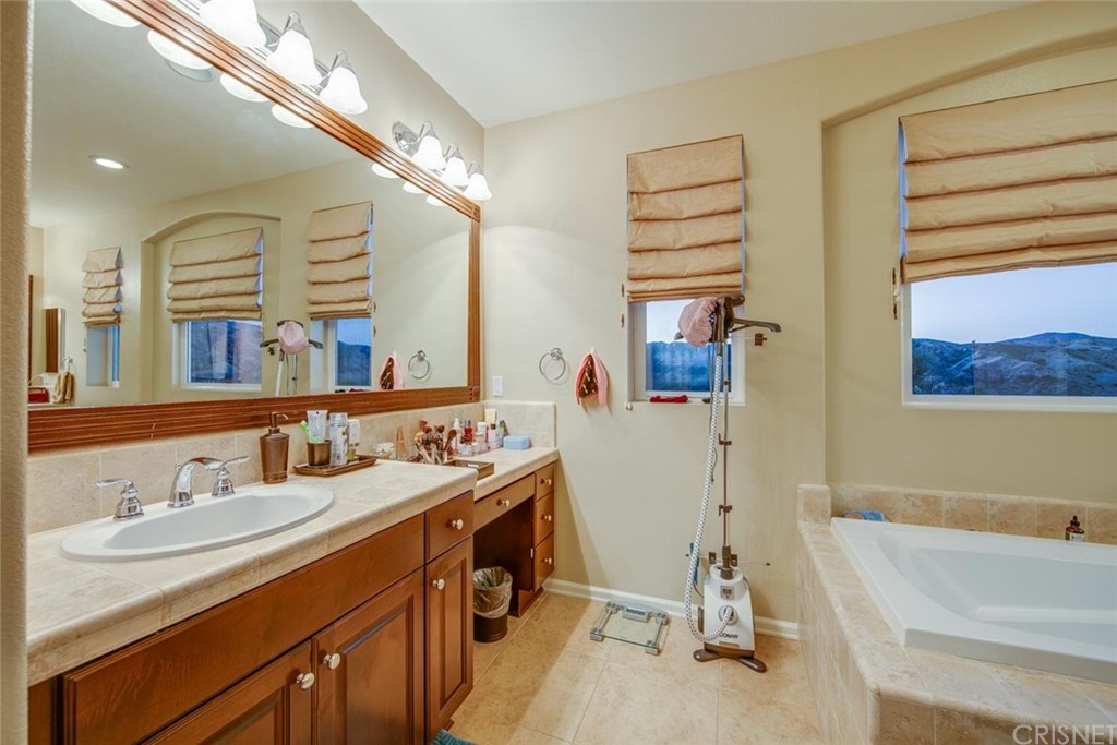 20855 Piazza Way Porter Ranch, CA 91326 - Photo 21 of 38 a bathroom with a sink double vanity