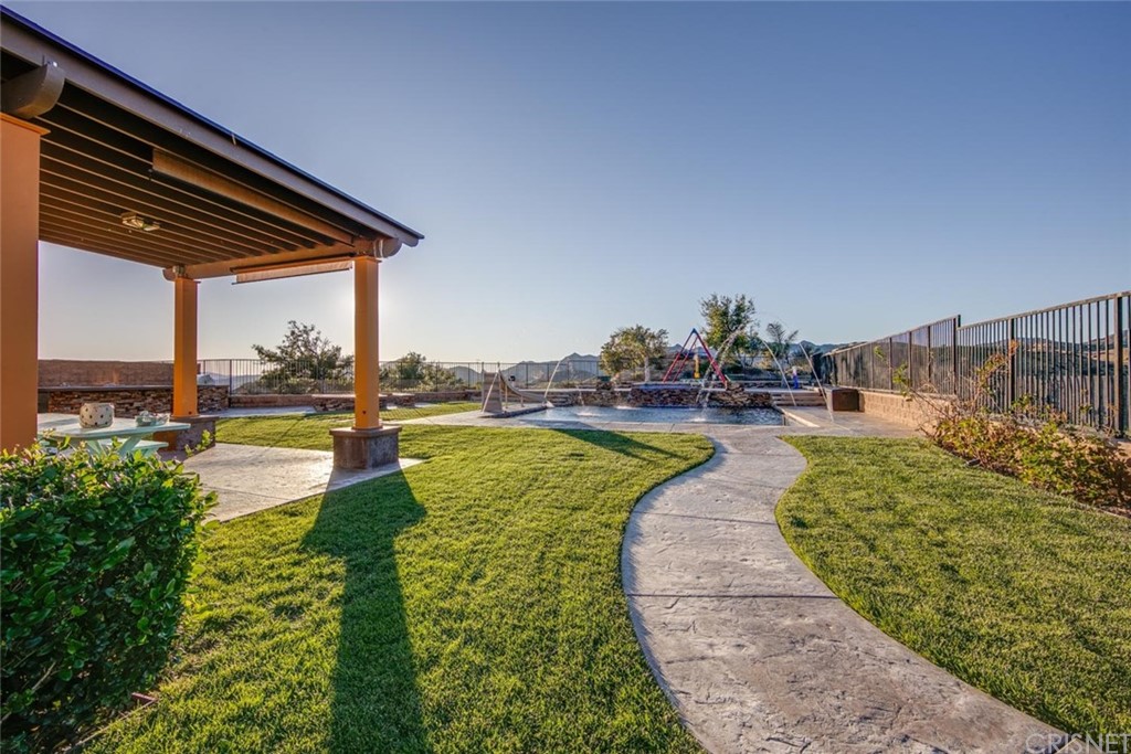 20855 Piazza Way Porter Ranch, CA 91326 - Photo 24 of 38 a view of a swimming pool with an outdoor space and seating area