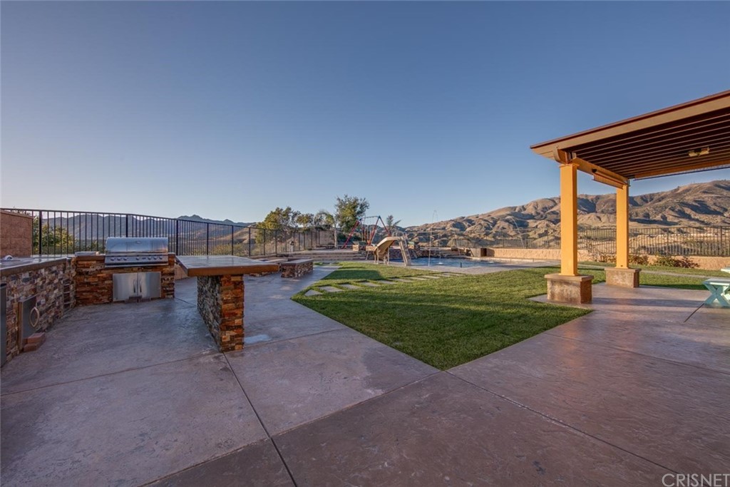 20855 Piazza Way Porter Ranch, CA 91326 - Photo 25 of 38 a view of a backyard