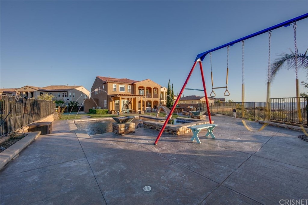 20855 Piazza Way Porter Ranch, CA 91326 - Photo 26 of 38 a view of playground with a slide