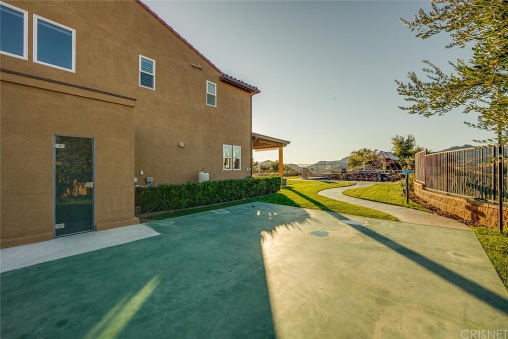 20855 Piazza Way Porter Ranch, CA 91326 - Photo 35 of 38 a view of a house with a swimming pool