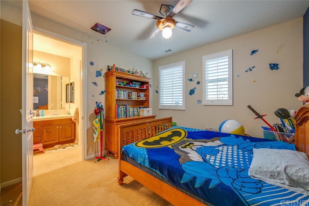 20855 Piazza Way Porter Ranch, CA 91326 - Photo 10 of 38 a bedroom with a bed furniture and a window